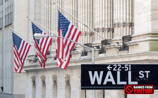 photo of wall street with American flags