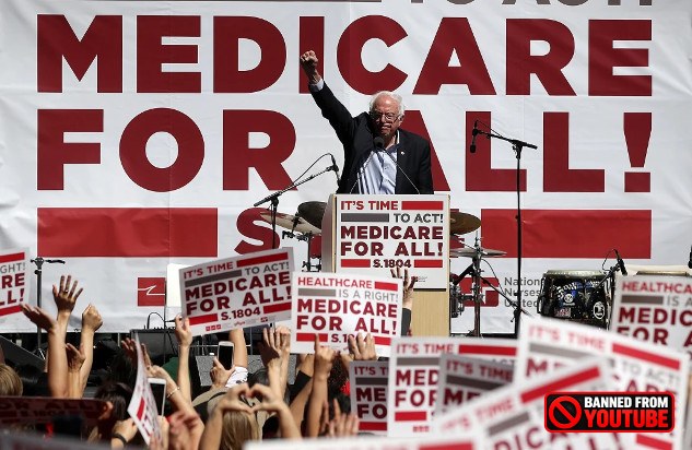 A rally with signs reading “Medicare for all,” showcasing grassroots advocacy.
